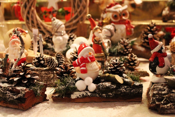 Christmas decorations with Santa, snowman, owl, and pine cones