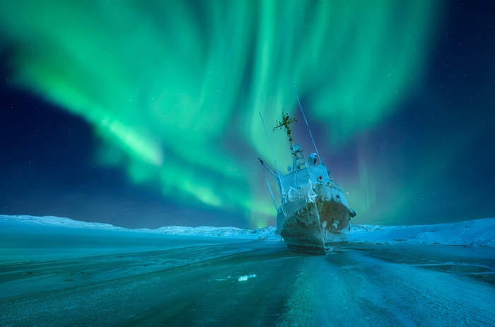Shipwreck under Aurora Borealis in Russia