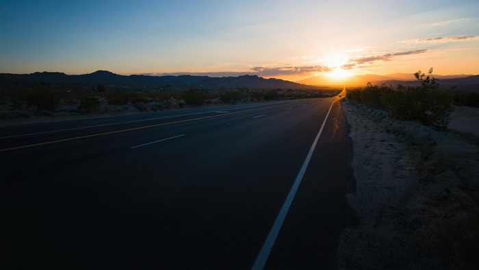 Desert highway at sunrise