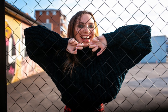 Woman behind a fence