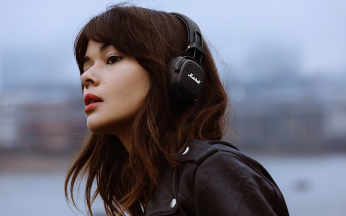 Woman wearing Marshall headphones