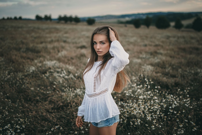 Woman with long hair in a field