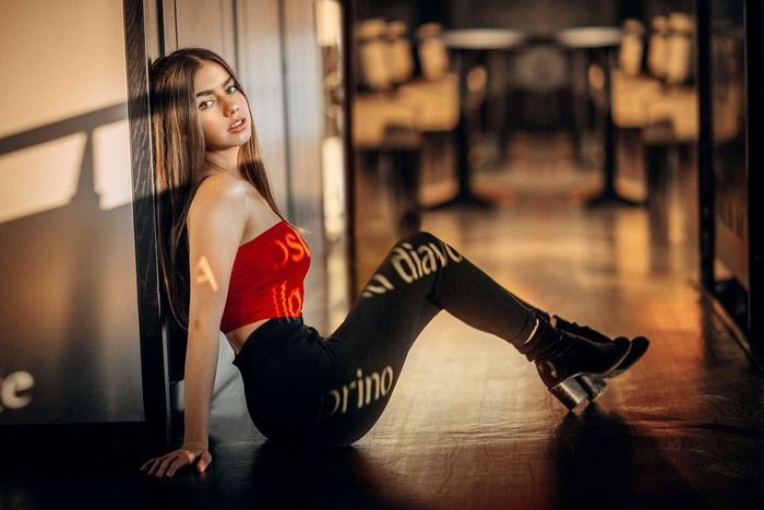 Brunette Woman with Long Hair Sitting Indoors