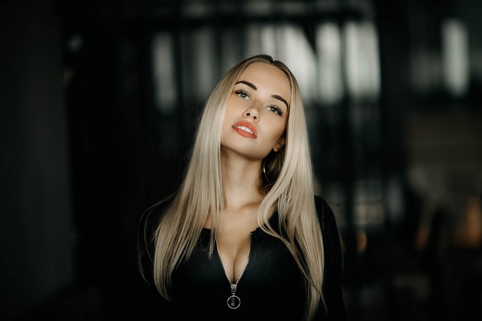 Blonde woman in a black top