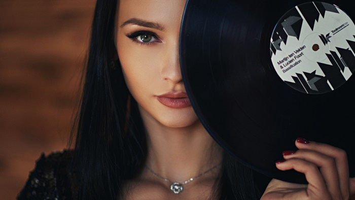 Woman holding a vinyl record