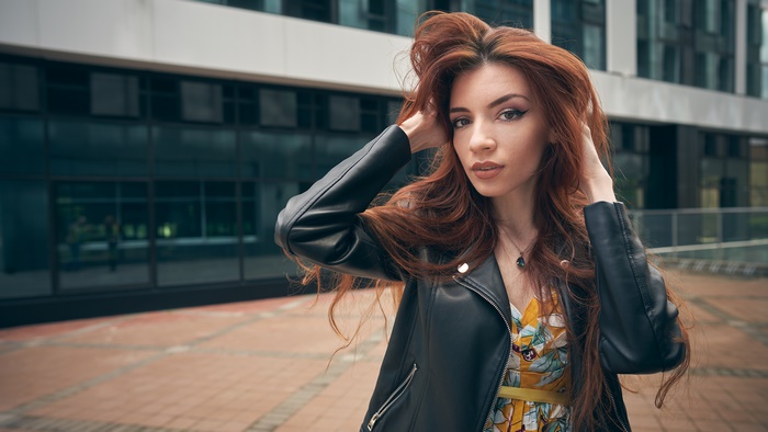 Redhead woman in leather jacket