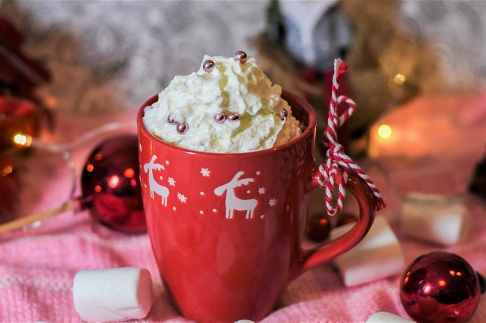 Christmas mug with whipped cream and ornaments