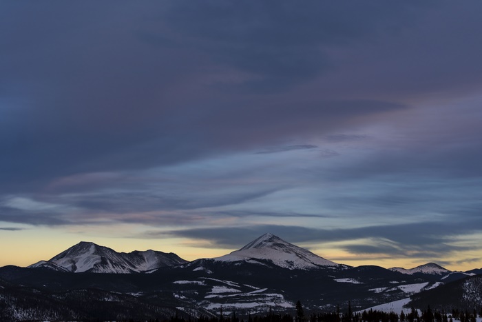 Snowy Mountains Under Cloudy Sky