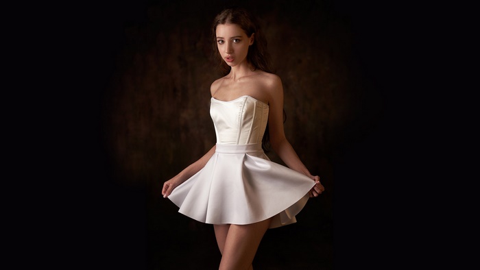 Woman in elegant white strapless dress