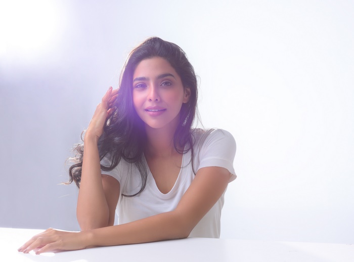Aishwarya Lekshmi sitting at a table