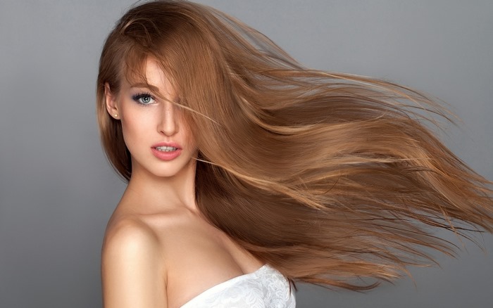 Model with flowing auburn hair