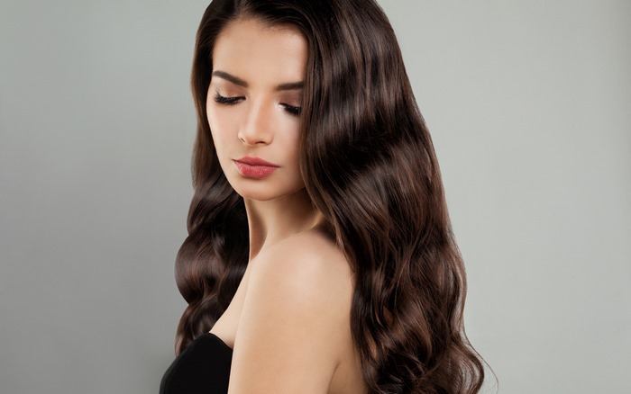 Model with Long Curly Brown Hair