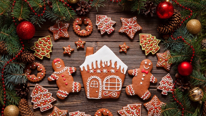 Christmas gingerbread cookies and decorations on wooden table
