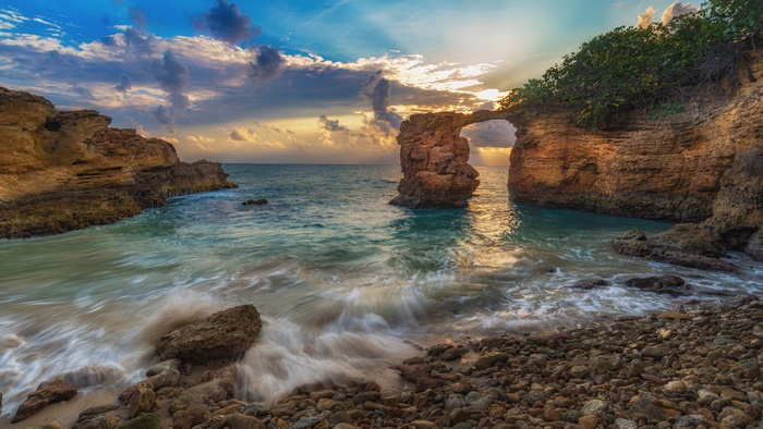 Coastal Arch Rock Formation at Sunset