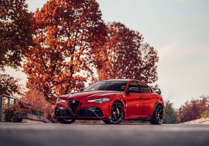 Red Alfa Romeo Giulia Quadrifoglio in Autumn