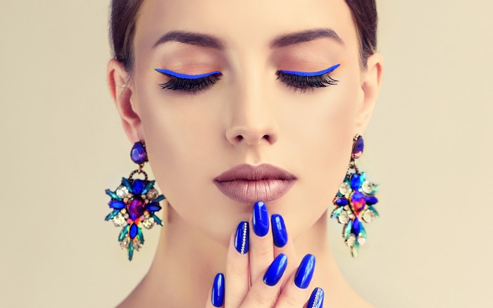 Model with Blue Eyeliner and Earrings