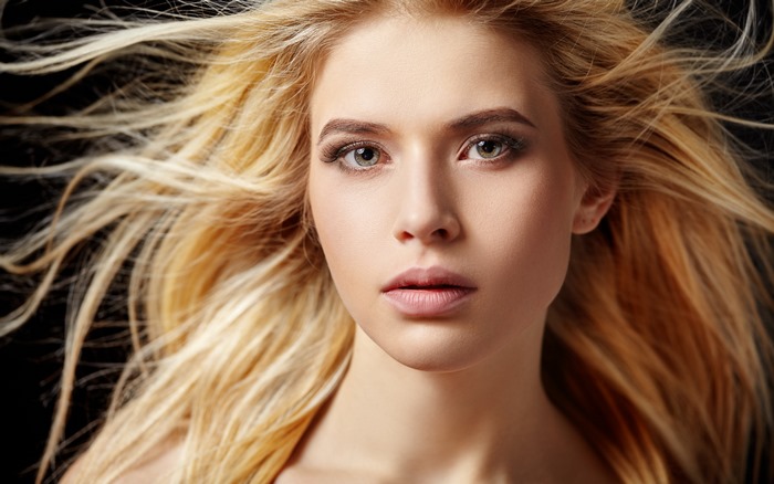 Blonde woman with windblown hair