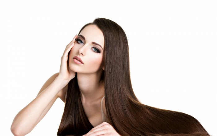 Brunette woman with long hair and makeup