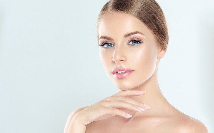 Beautiful Blonde Woman with Blue Eyes and Makeup