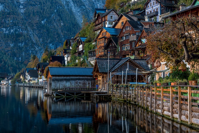 Hallstatt Austria village on a lake with mountain backdrop 4K