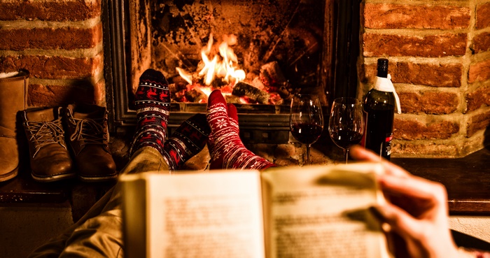 Cozy Fireplace Scene with Wine and Book