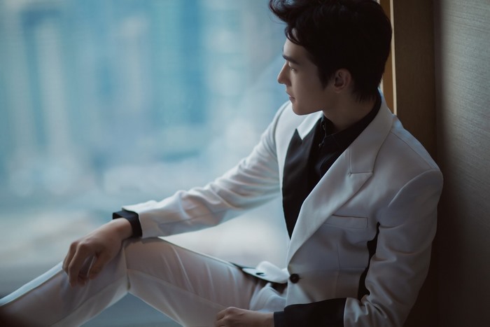 Yang Yang in a white suit