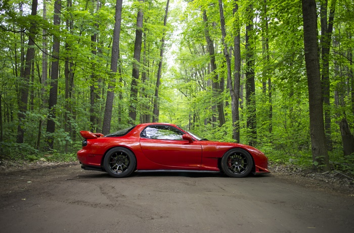 Red Mazda RX-7 Sport Car in Forest