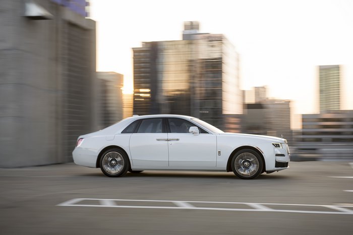 White Rolls-Royce Ghost driving in city