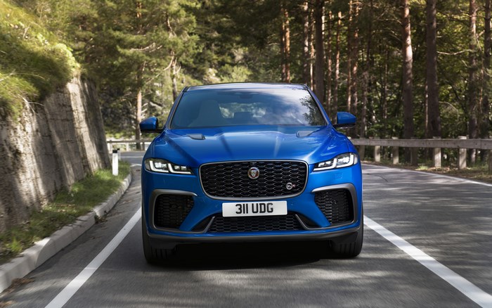 Blue Jaguar F-Pace SVR driving on a road