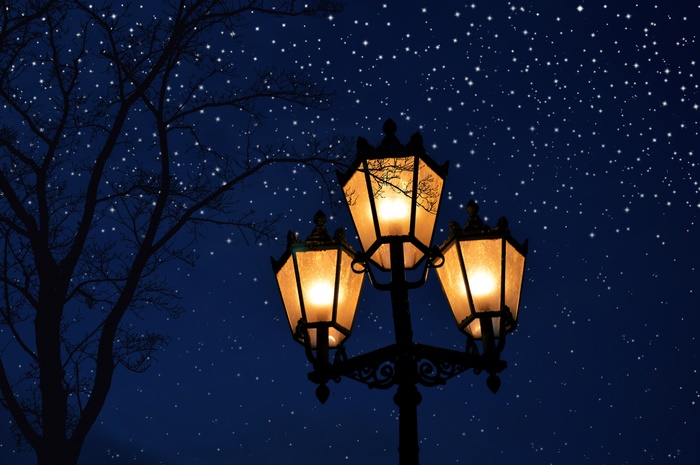 Street lamp under a starry night sky