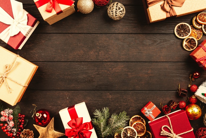 Christmas gifts and ornaments on wooden table