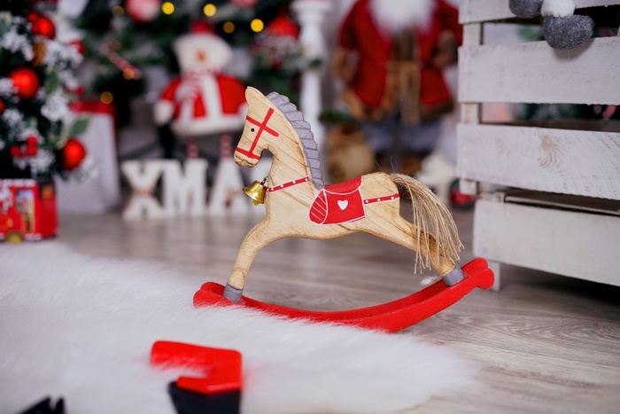 Wooden rocking horse with Christmas decorations