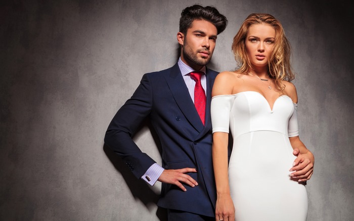Man in suit and woman in white dress