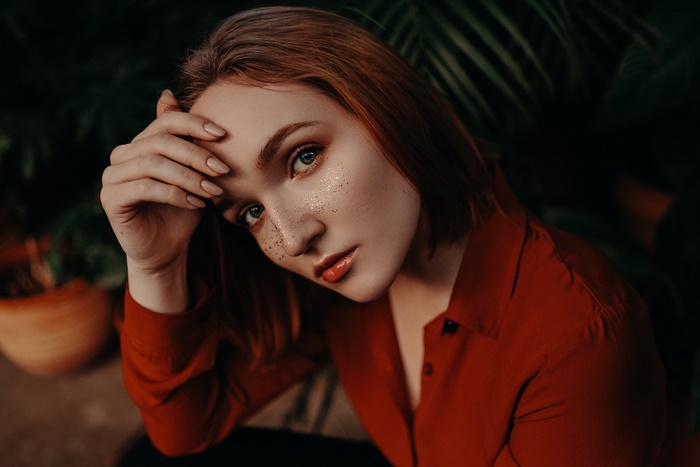 Woman with red hair and freckles
