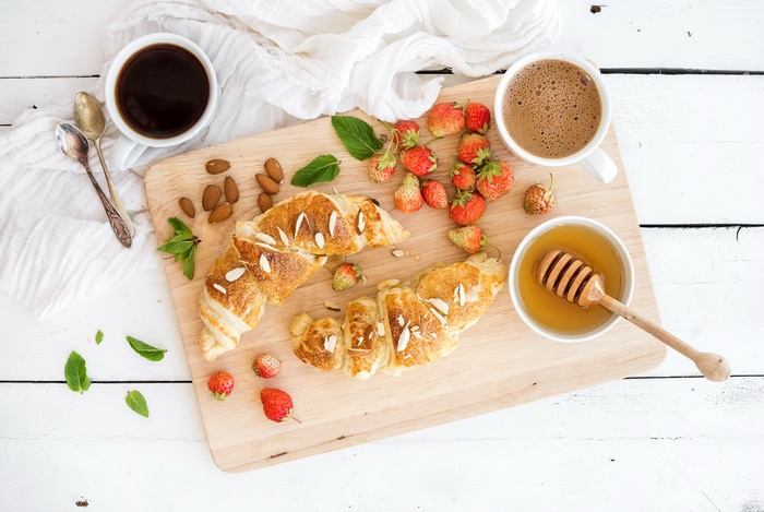 Breakfast with Croissant, Strawberries, Coffee, and Honey
