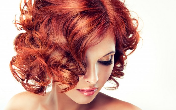 Woman with Red Curly Hair and Makeup
