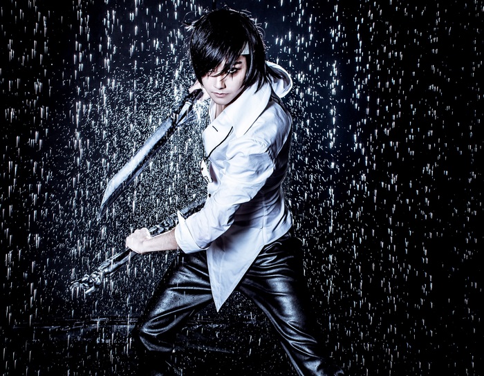 Cosplayer with sword in the rain