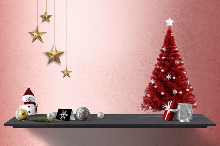 Christmas tree with ornaments and gifts on a shelf