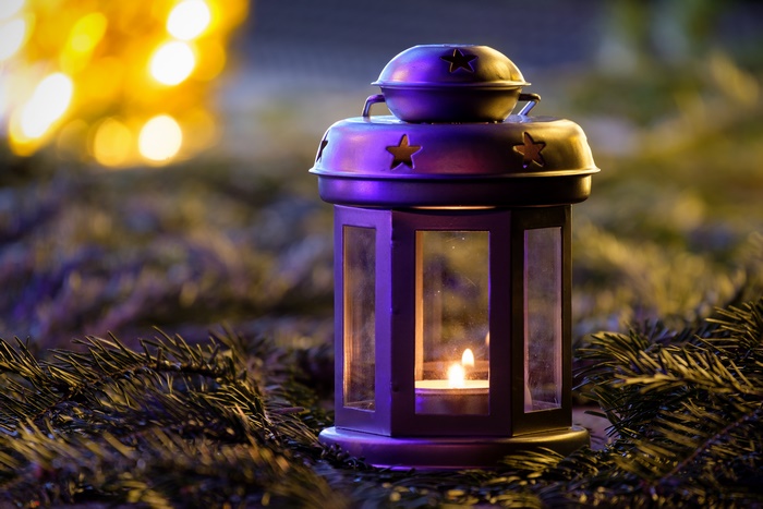 Christmas lantern with candle and fir branches