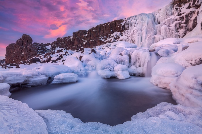 Frozen Waterfall in Iceland at Sunset