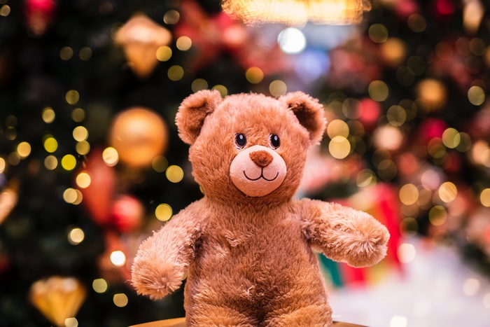 Teddy Bear in front of a Christmas Tree with Bokeh