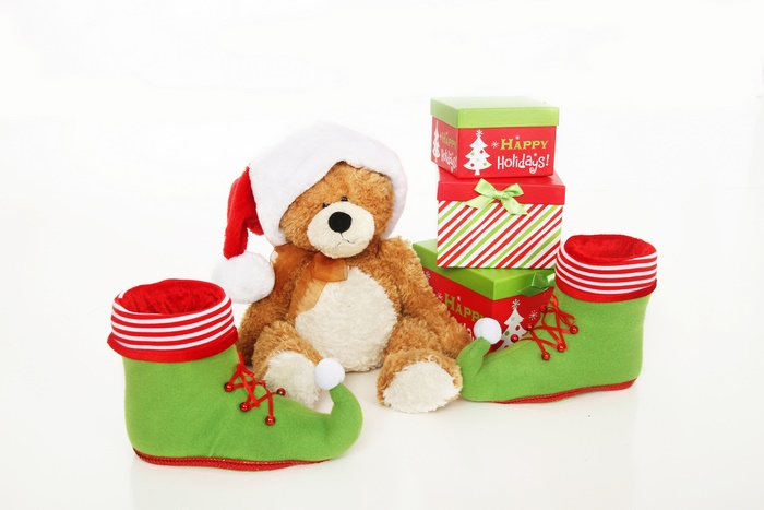 Teddy bear with Santa hat and elf shoes, Christmas gifts