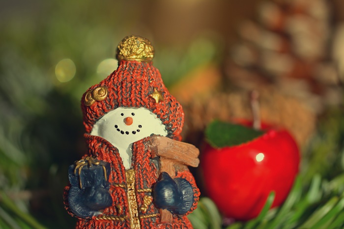 Christmas snowman figurine with apple