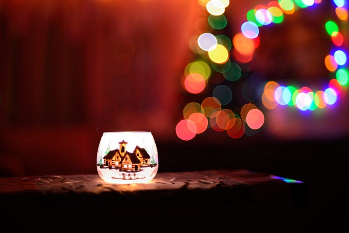 Christmas candle holder with bokeh lights