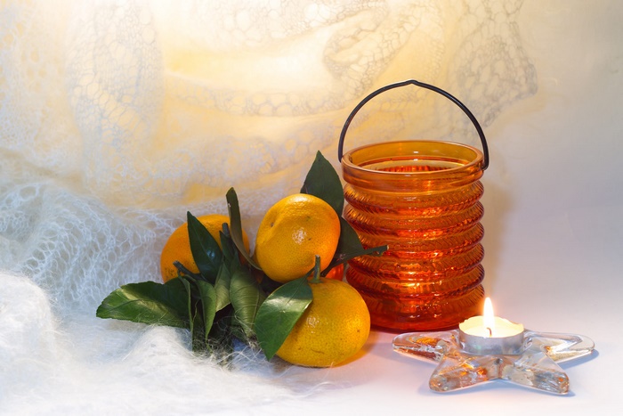 Mandarin oranges with a candle and lantern