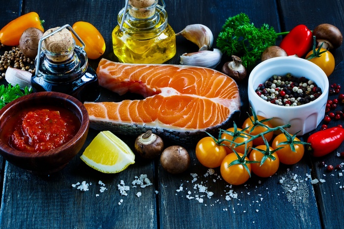 Salmon steak with fresh ingredients and spices