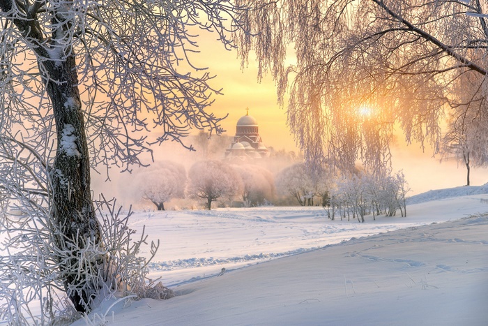 Winter park with church at dawn