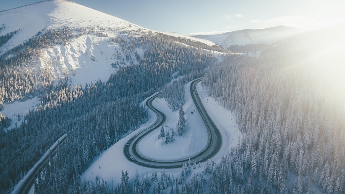 Aerial Photography of Snowy Mountain Road and Forest