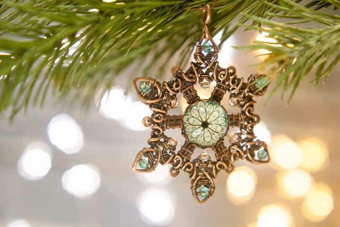 Wire-wrapped snowflake ornament with blue beads