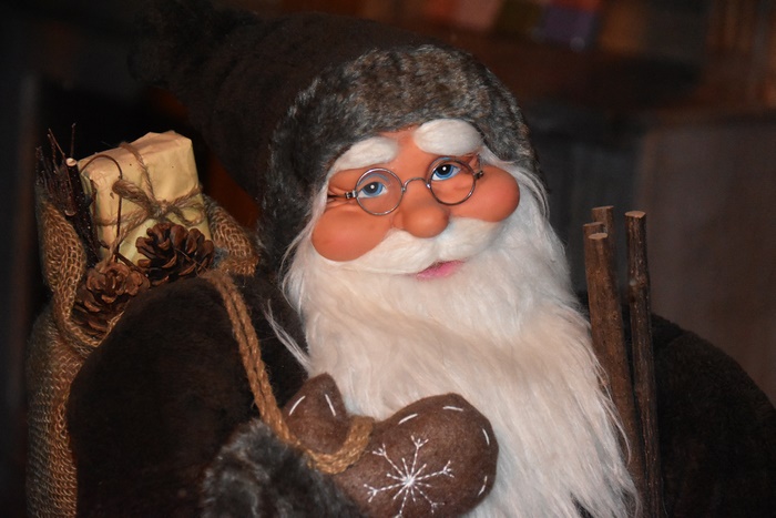 Santa Claus with gifts and pine cones